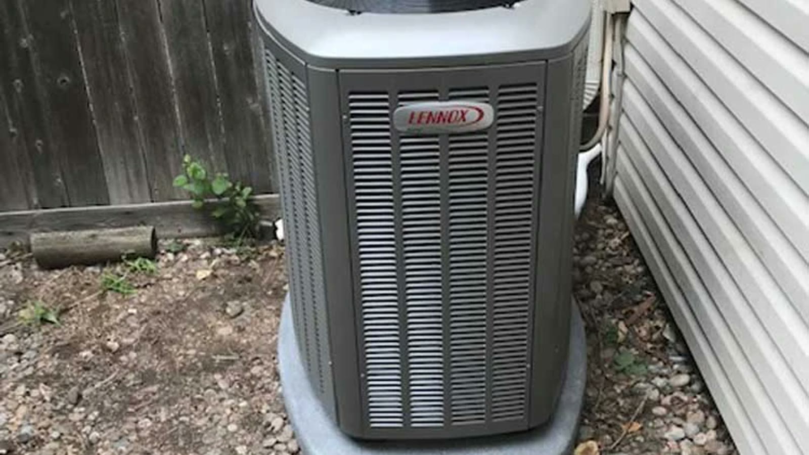 Outdoor air-conditioning condenser beside a Tempe home